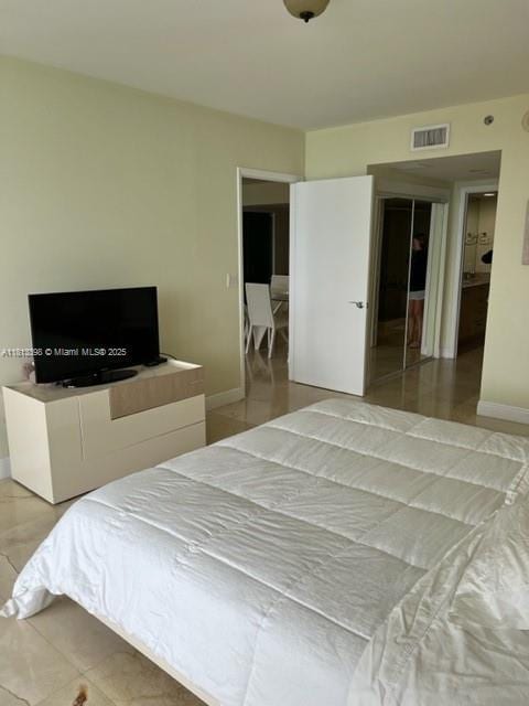 1830 S Ocean Dr Unit 2103, Hallandale Beach, FL 33009 - bedroom featuring baseboards and light tile patterned flooring