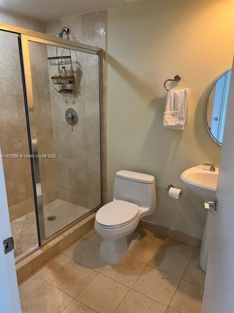 1830 S Ocean Dr Unit 2103, Hallandale Beach, FL 33009 - full bath featuring toilet, tile patterned floors, a stall shower, and baseboards