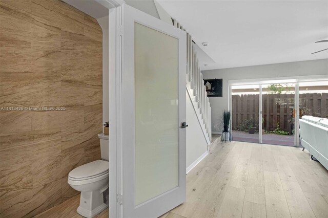 3897 NW 122nd Ter, Sunrise, FL 33323 - bathroom featuring toilet, wood finished floors, and ceiling fan