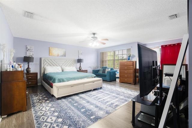 2620 NW 79th Ave, Margate, FL 33063 - bedroom with wood finished floors, a textured ceiling, and ceiling fan