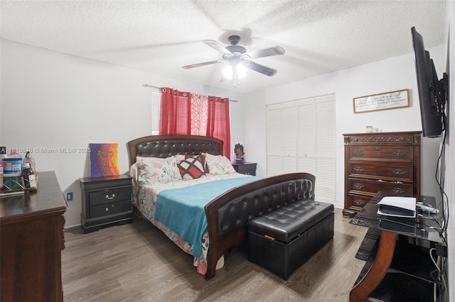 2620 NW 79th Ave, Margate, FL 33063 - bedroom featuring wood finished floors, a ceiling fan, a textured ceiling, and a closet