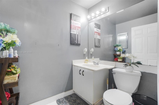2620 NW 79th Ave, Margate, FL 33063 - half bathroom featuring vanity, toilet, and baseboards