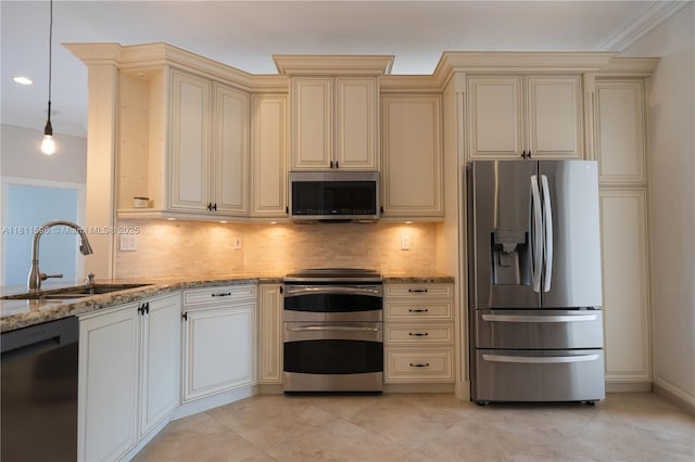 16404 Diamond Pl, Weston, FL 33331 - kitchen with stainless steel appliances, cream cabinets, a sink, light stone counters, and backsplash
