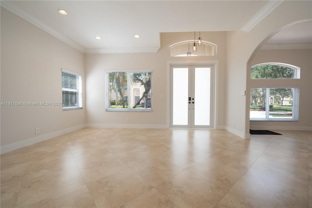 16404 Diamond Pl, Weston, FL 33331 - entryway with light tile patterned flooring, ornamental molding, french doors, arched walkways, and recessed lighting