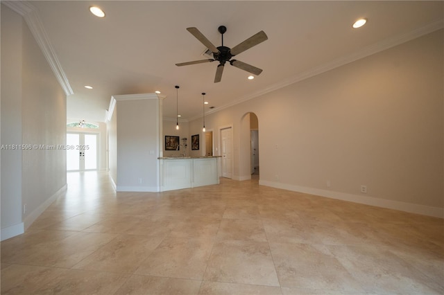 16404 Diamond Pl, Weston, FL 33331 - unfurnished living room featuring arched walkways, recessed lighting, a ceiling fan, ornamental molding, and baseboards