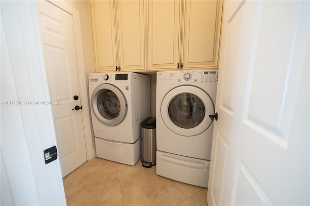 16404 Diamond Pl, Weston, FL 33331 - laundry area featuring washing machine and clothes dryer, cabinet space, and light tile patterned floors