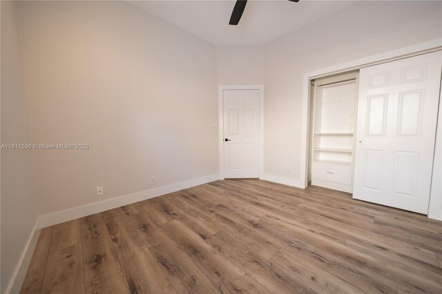 16404 Diamond Pl, Weston, FL 33331 - unfurnished bedroom with baseboards, wood finished floors, ceiling fan, and a closet