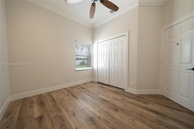 16404 Diamond Pl, Weston, FL 33331 - unfurnished bedroom featuring ornamental molding, wood finished floors, a closet, baseboards, and ceiling fan