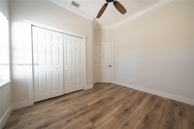16404 Diamond Pl, Weston, FL 33331 - unfurnished bedroom featuring crown molding, light wood-type flooring, baseboards, a closet, and a ceiling fan