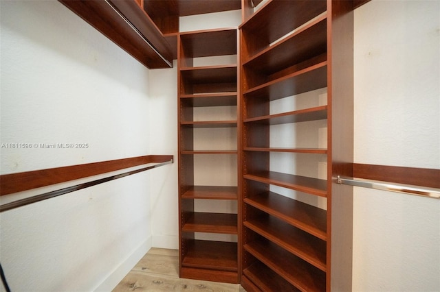 16404 Diamond Pl, Weston, FL 33331 - walk in closet featuring light wood-style floors