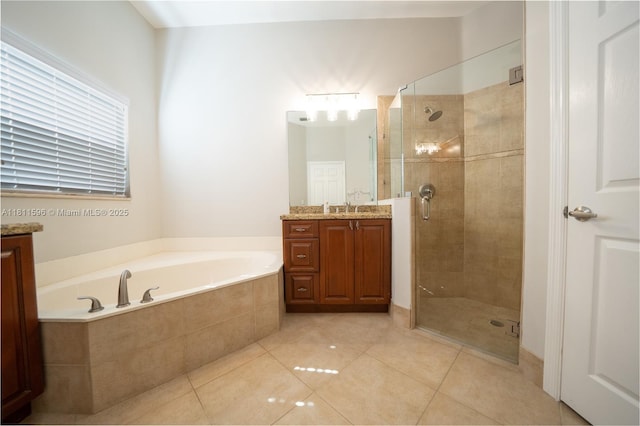 16404 Diamond Pl, Weston, FL 33331 - bathroom featuring vanity, a shower stall, a bath, and tile patterned floors