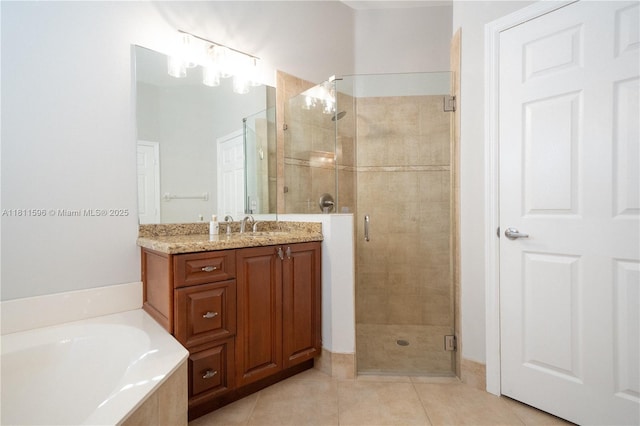 16404 Diamond Pl, Weston, FL 33331 - full bathroom featuring a shower stall, vanity, a garden tub, and tile patterned floors