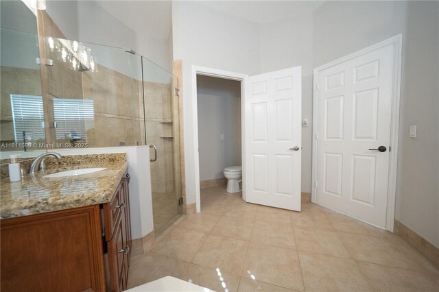 16404 Diamond Pl, Weston, FL 33331 - bathroom with vanity, a stall shower, toilet, tile patterned flooring, and baseboards