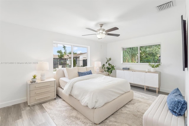 4331 NW 9th Ct, Coconut Creek, FL 33066 - bedroom with light wood-style flooring, baseboards, and ceiling fan