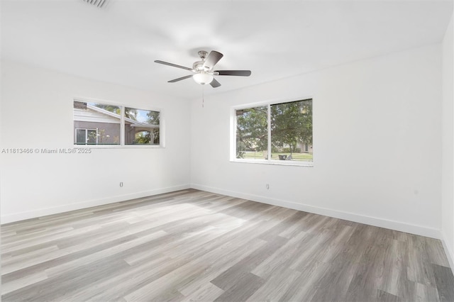 4331 NW 9th Ct, Coconut Creek, FL 33066 - empty room featuring a ceiling fan, wood finished floors, and baseboards