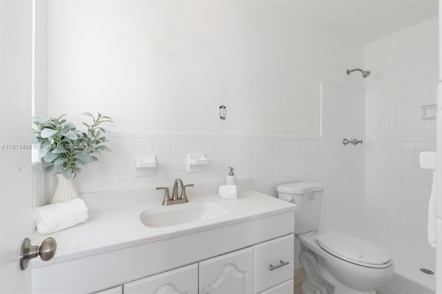 4331 NW 9th Ct, Coconut Creek, FL 33066 - full bath with toilet, tiled shower, vanity, tile walls, and wainscoting