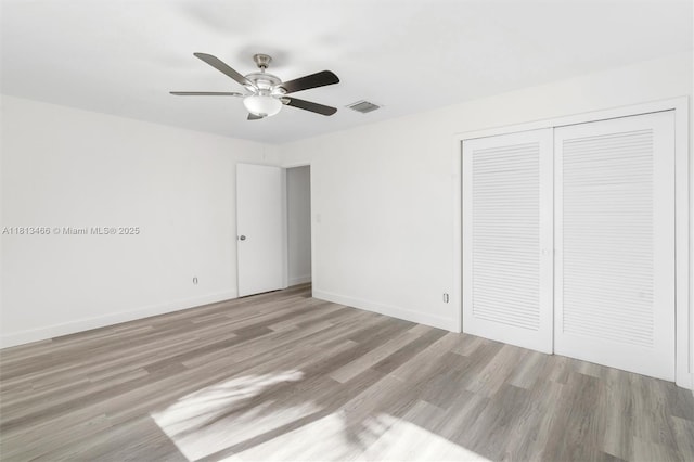 4331 NW 9th Ct, Coconut Creek, FL 33066 - unfurnished bedroom with a closet, wood finished floors, baseboards, and ceiling fan