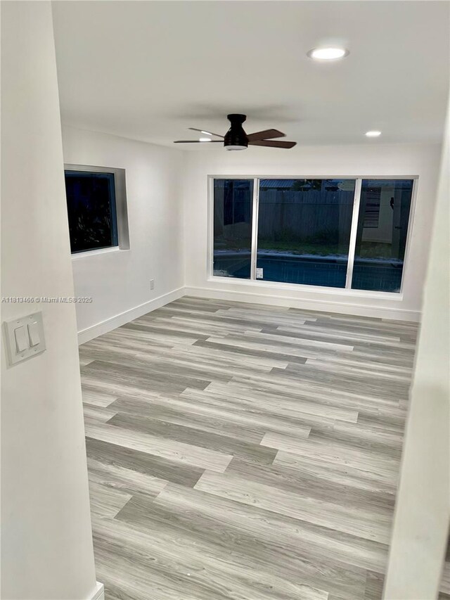 4331 NW 9th Ct, Coconut Creek, FL 33066 - spare room with wood finished floors, a ceiling fan, baseboards, and recessed lighting
