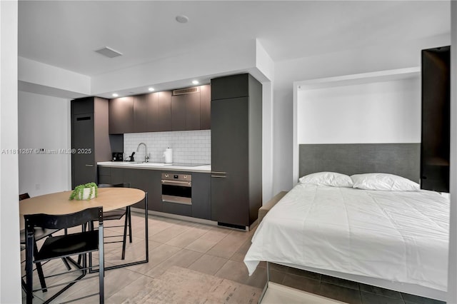 227 NE 2nd St Unit 2208, Miami, FL 33132 - bedroom with a sink and recessed lighting