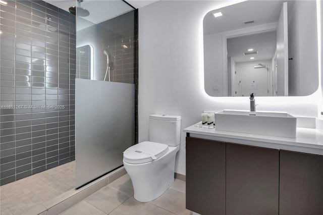 227 NE 2nd St Unit 2208, Miami, FL 33132 - full bath featuring a walk in shower, vanity, tile patterned flooring, and toilet