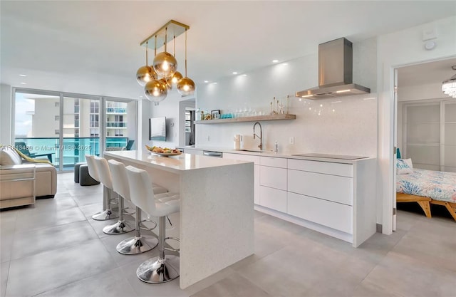 4001 S Ocean Dr Unit 14H, Hollywood, FL 33019 - kitchen with extractor fan, a sink, modern cabinets, light countertops, and white cabinetry