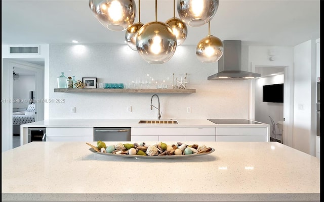 4001 S Ocean Dr Unit 14H, Hollywood, FL 33019 - kitchen with wall chimney range hood, a sink, stainless steel dishwasher, black electric cooktop, and white cabinets