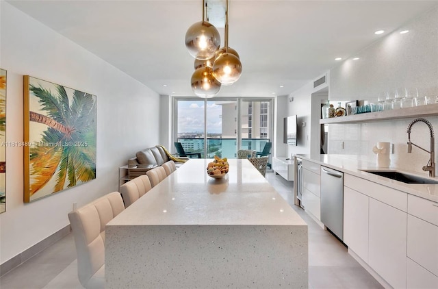 4001 S Ocean Dr Unit 14H, Hollywood, FL 33019 - kitchen with a sink, dishwasher, open floor plan, modern cabinets, and white cabinets