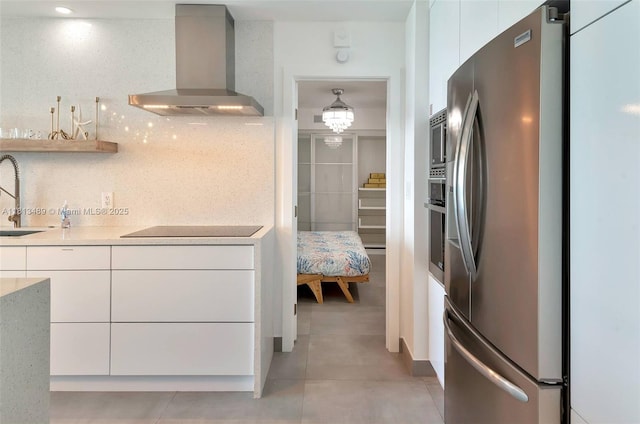 4001 S Ocean Dr Unit 14H, Hollywood, FL 33019 - kitchen featuring wall chimney range hood, stainless steel appliances, a sink, backsplash, and modern cabinets