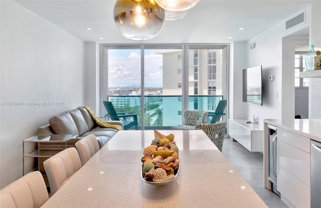 4001 S Ocean Dr Unit 14H, Hollywood, FL 33019 - dining space with plenty of natural light, expansive windows, and wine cooler