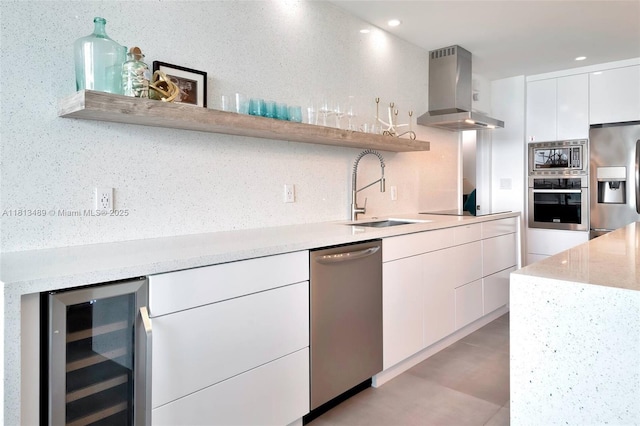 4001 S Ocean Dr Unit 14H, Hollywood, FL 33019 - kitchen with open shelves, wine cooler, appliances with stainless steel finishes, island exhaust hood, and a sink