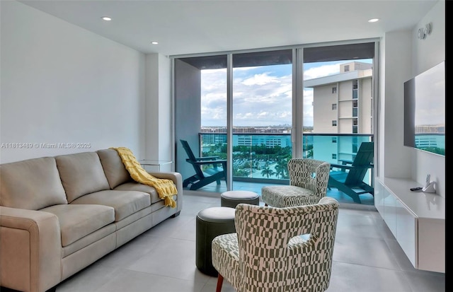 4001 S Ocean Dr Unit 14H, Hollywood, FL 33019 - living room with floor to ceiling windows, recessed lighting, and light tile patterned flooring