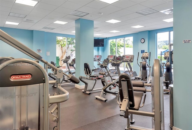 4001 S Ocean Dr Unit 14H, Hollywood, FL 33019 - exercise room with a drop ceiling and healthy amount of natural light