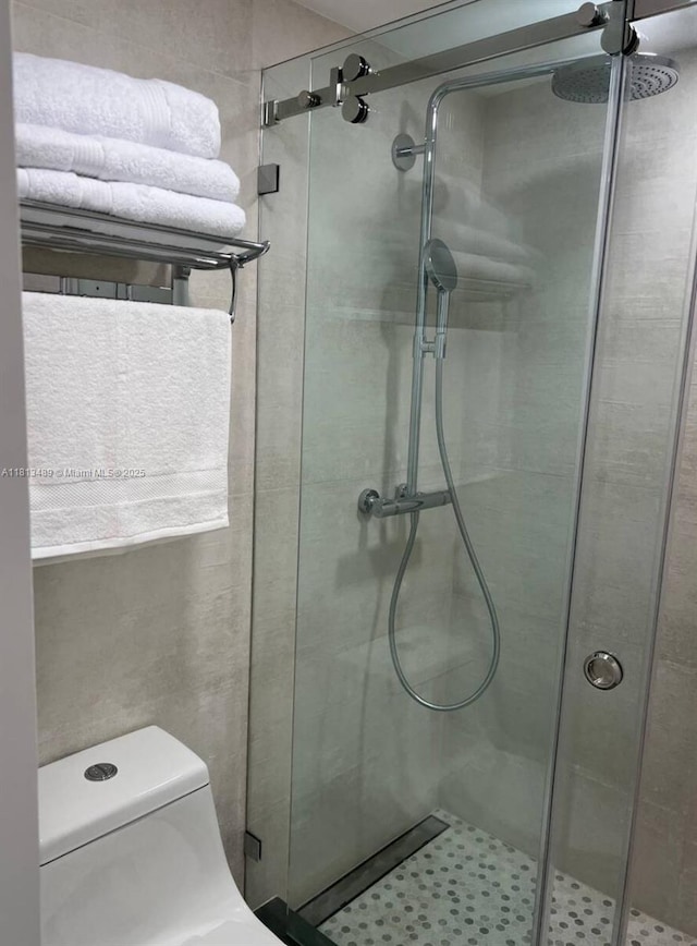 4001 S Ocean Dr Unit 14H, Hollywood, FL 33019 - bathroom with a shower stall and toilet