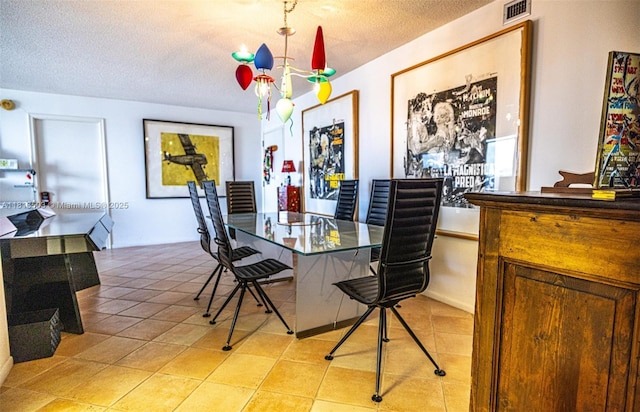 2841 N Ocean Blvd Unit 1809, Fort Lauderdale, FL 33308 - dining space featuring a textured ceiling, light tile patterned floors, and a desk