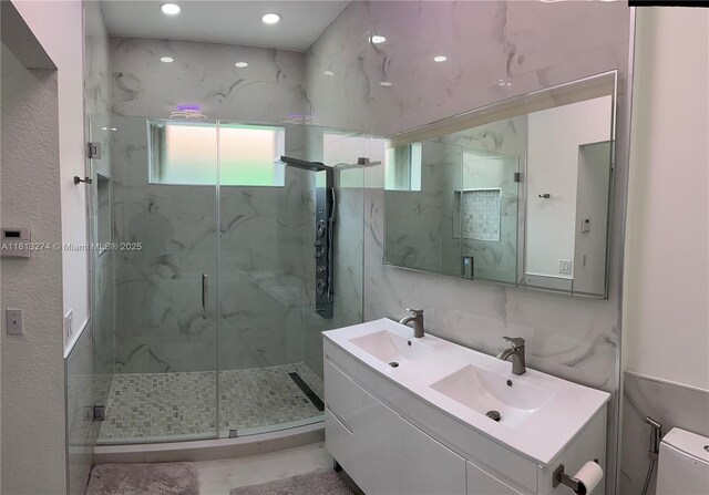 8792 NW 167th St, Miami Lakes, FL 33018 - full bathroom featuring a marble finish shower, double vanity, and toilet