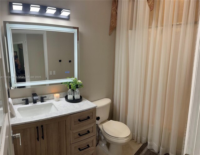 8792 NW 167th St, Miami Lakes, FL 33018 - bathroom featuring vanity, toilet, and tile patterned flooring
