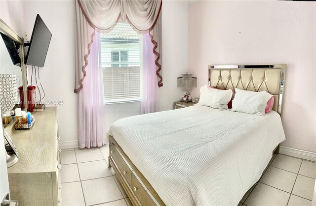 8792 NW 167th St, Miami Lakes, FL 33018 - bedroom with light tile patterned flooring and baseboards