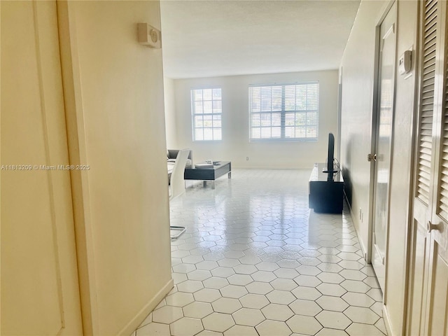 3475 S Ocean Blvd Unit 1130, Palm Beach, FL 33480 - hallway featuring baseboards and light tile patterned floors