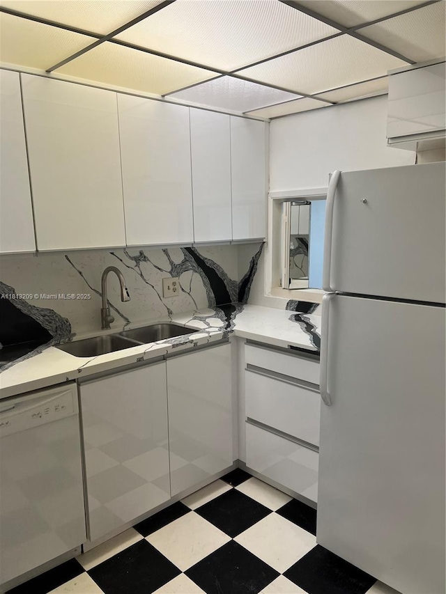 3475 S Ocean Blvd Unit 1130, Palm Beach, FL 33480 - kitchen with white appliances, light floors, white cabinets, and a sink