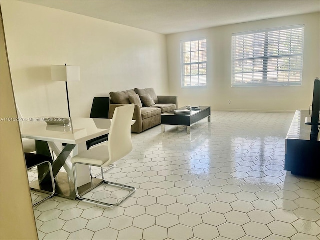 3475 S Ocean Blvd Unit 1130, Palm Beach, FL 33480 - tiled living room featuring baseboards