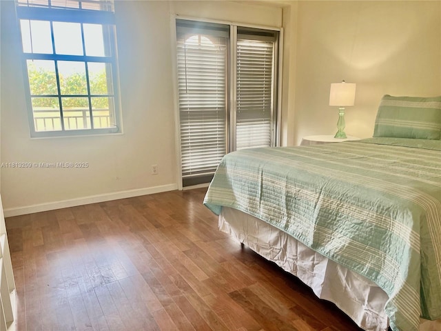 3475 S Ocean Blvd Unit 1130, Palm Beach, FL 33480 - bedroom with baseboards and wood finished floors