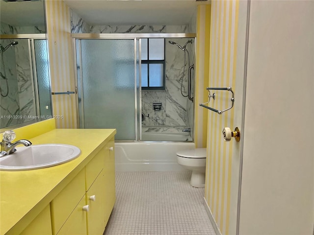 3475 S Ocean Blvd Unit 1130, Palm Beach, FL 33480 - bathroom featuring toilet, vanity, bath / shower combo with glass door, and tile patterned flooring