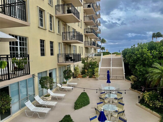3475 S Ocean Blvd Unit 1130, Palm Beach, FL 33480 - view of property's community featuring outdoor dining space, a patio, and stairway