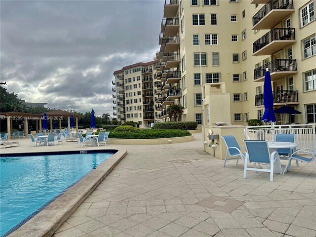 3475 S Ocean Blvd Unit 1130, Palm Beach, FL 33480 - community pool featuring a patio
