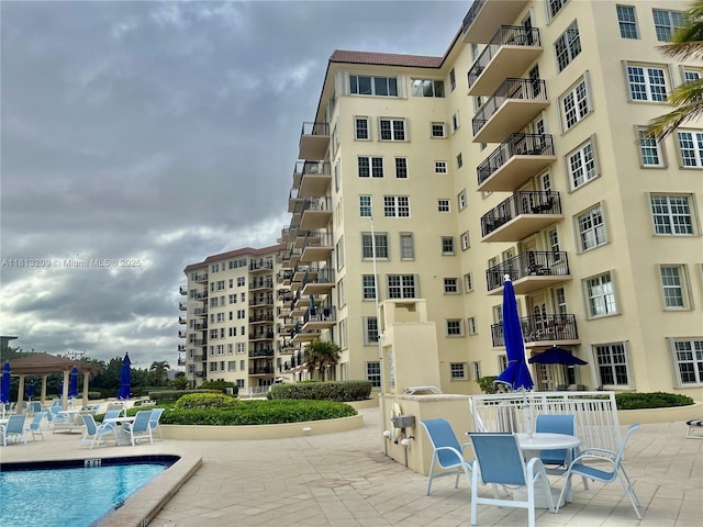 3475 S Ocean Blvd Unit 1130, Palm Beach, FL 33480 - community pool featuring a patio area
