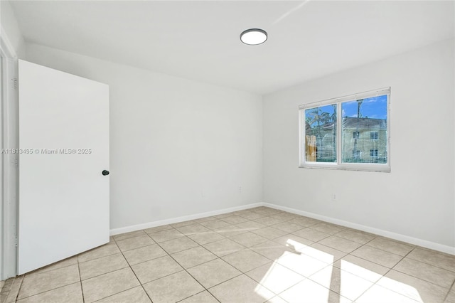 3398 NE 9th Dr Unit 104, Homestead, FL 33033 - empty room with light tile patterned floors and baseboards