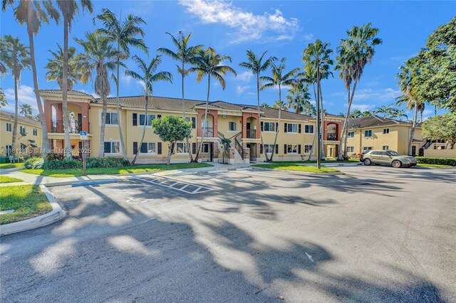 3398 NE 9th Dr Unit 104, Homestead, FL 33033 - view of property featuring a residential view and uncovered parking