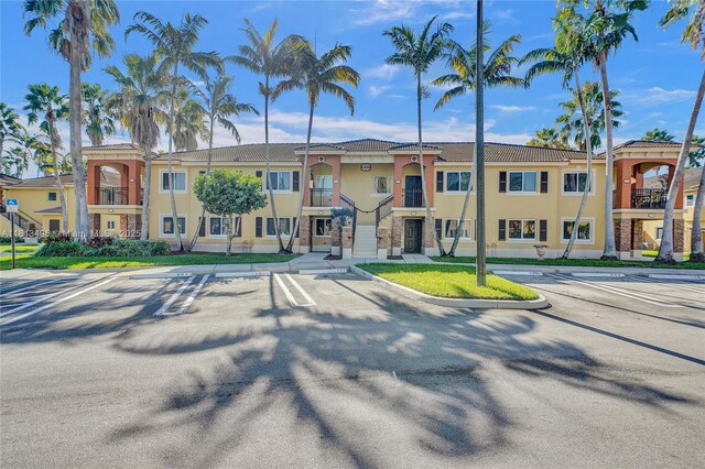 3398 NE 9th Dr Unit 104, Homestead, FL 33033 - view of property with uncovered parking