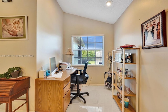 6081 Bluegrass Dr, Boynton Beach, FL 33437 - home office with vaulted ceiling, light tile patterned floors, and baseboards
