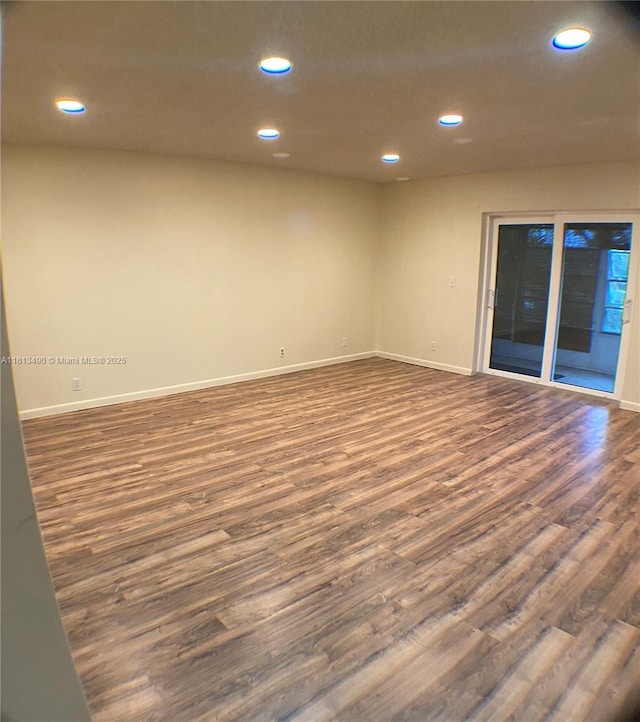 2061 NW 47th Ter Unit 205, Lauderhill, FL 33313 - spare room featuring dark wood-style floors, recessed lighting, and baseboards